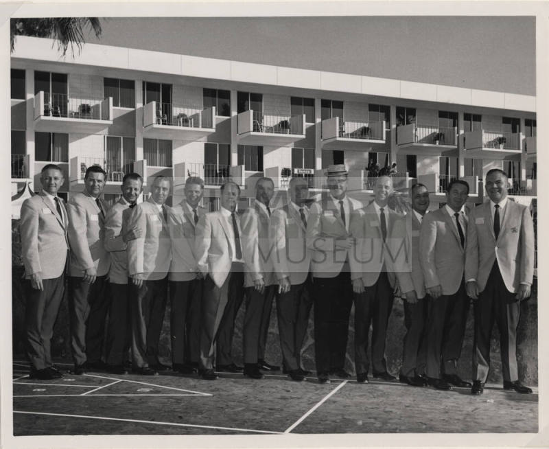 Larry Hayden with Twelve Men at a Hotel