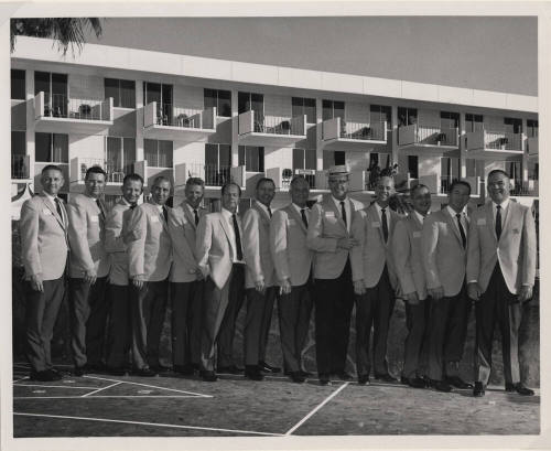 Larry Hayden with Twelve Men at a Hotel