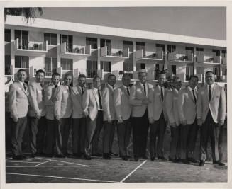 Larry Hayden with Twelve Men at a Hotel