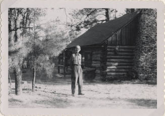 Willard Hart in Front of Sallie Hayden's Cabin