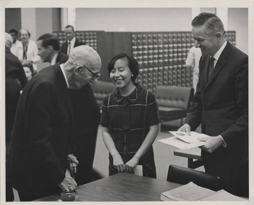 Carl Hayden speaks to a woman inside the C. T. Hayden Library at the convocation.