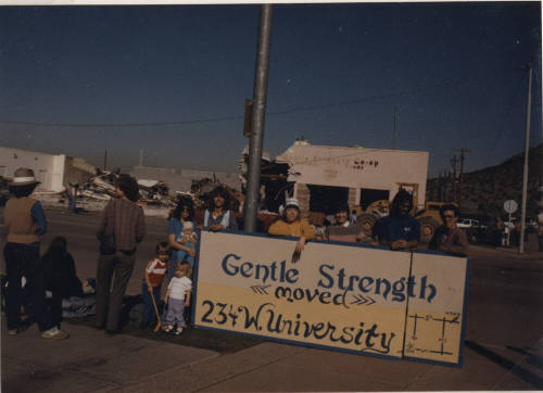 Gentle Strength Co-op Demolition View of Sign and Crowd
