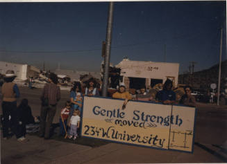 Gentle Strength Co-op Demolition View of Sign and Crowd