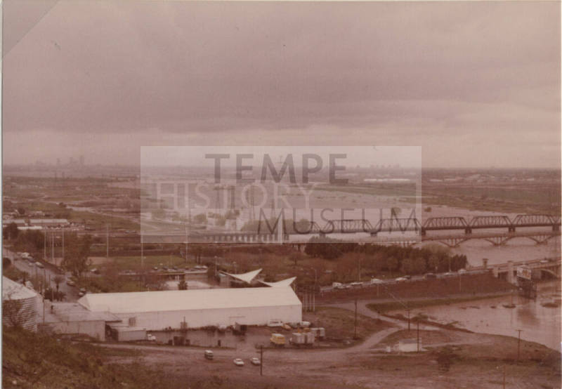 Flooded Salt River with Mill Avenue Bridge, Railroad Bridge, and Ash Avenue Bridge facing west