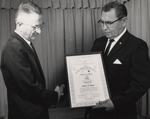 Charles Sigala receiving a certificate award from the Round Table of Orange County Joint Apprenticeship committee.