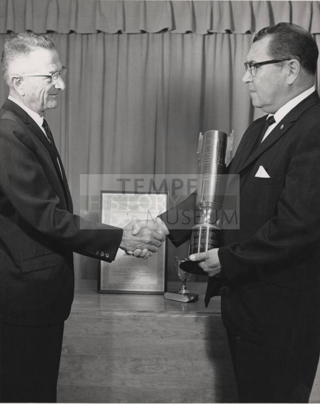 Charles Sigala receiving an award in California