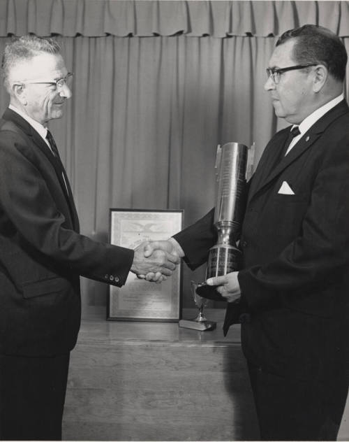 Charles Sigala receiving an award in California