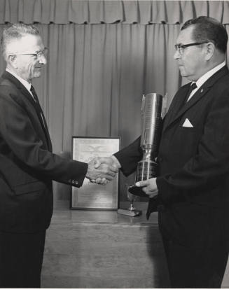 Charles Sigala receiving an award in California