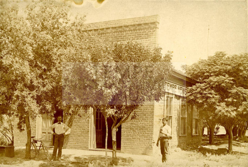 Curt Miller and Chris Sigala standing in front of the Tempe News building
