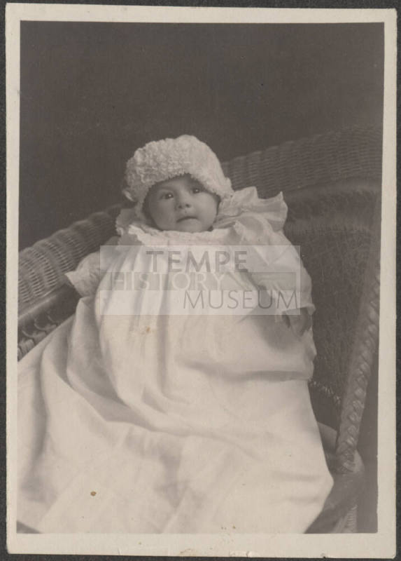 Baby in wicker chair