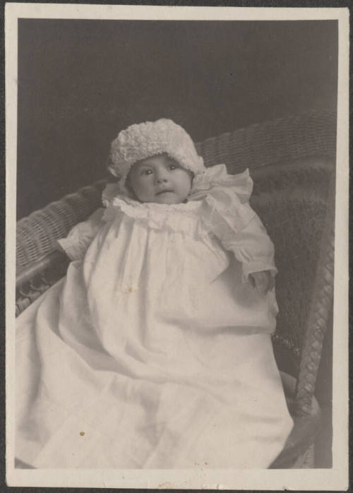 Baby in wicker chair