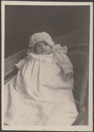 Baby in wicker chair