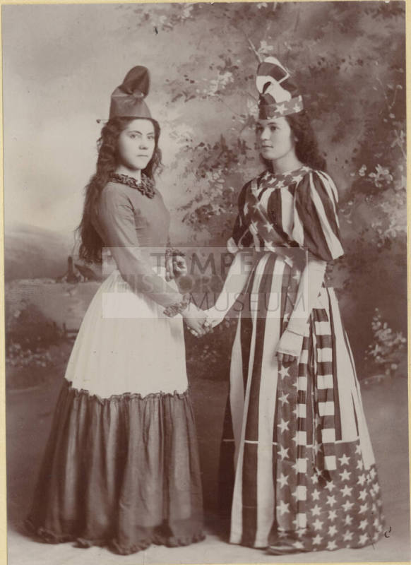 Two unknown ladies in special occasion dresses
