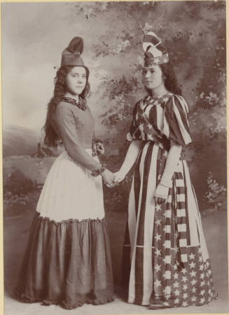 Two unknown ladies in special occasion dresses