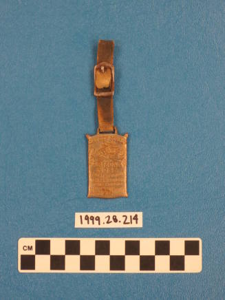 Metal fob on a leather strap