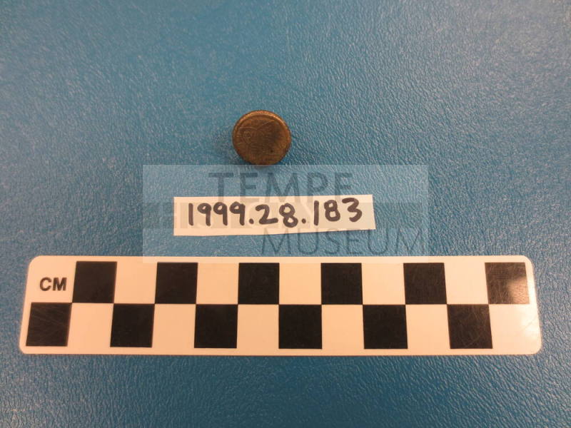 Pin (possibly a tie tac or lapel pin)