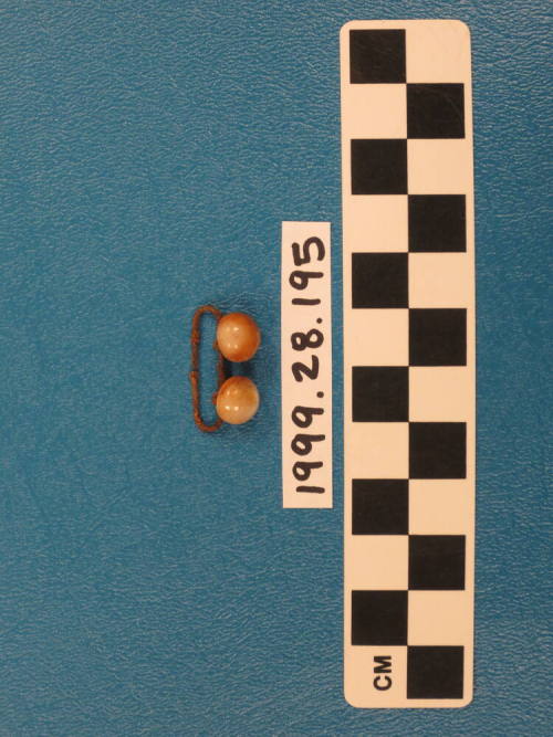 Metal clip with two buttons attached