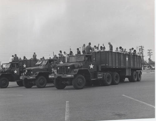 Young People in the Back of Military Transport Vehicles