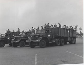 Young People in the Back of Military Transport Vehicles