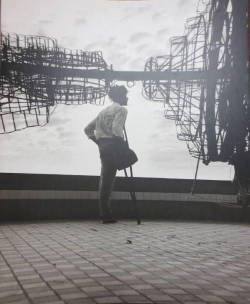 Boy Watching Men Making Fireworks Tower