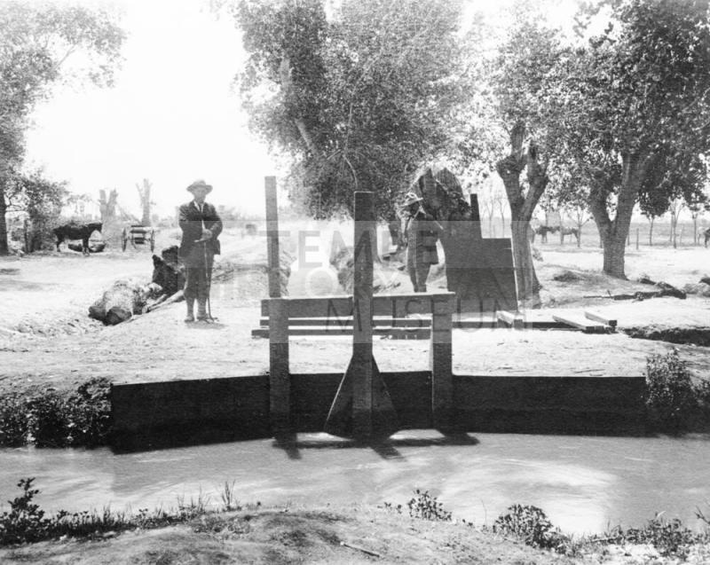 Controlling water from main canal to lateral canals