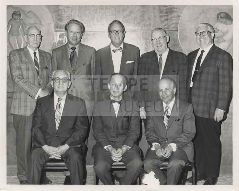 Two rows of men in suits