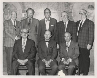 Two rows of men in suits