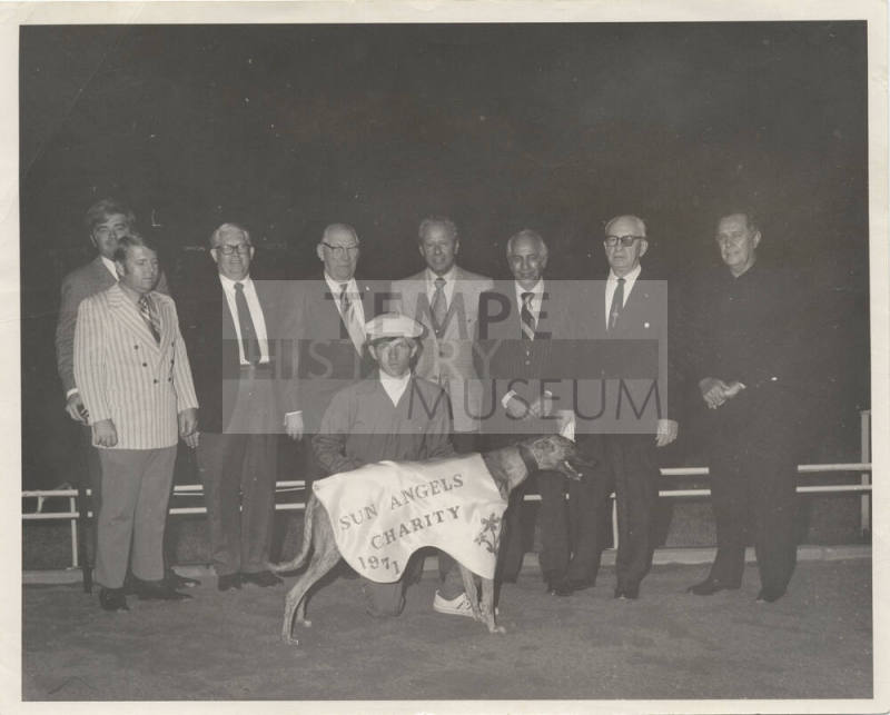 Sun Angels Charity with greyhound and group