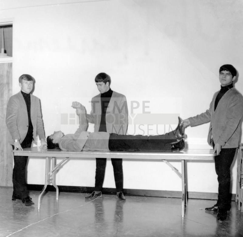 Hearsemen on Gurney Table