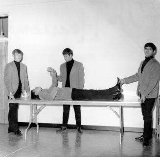 Hearsemen on Gurney Table