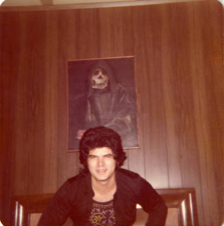 Harold Aceves Under Hooded Skeleton