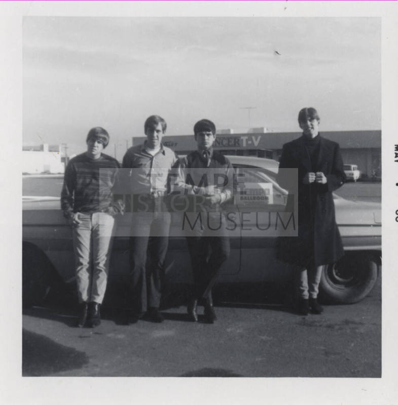 Hearsemen in Front of Car in Danelle Plaza