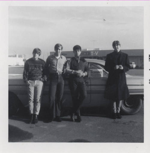 Hearsemen in Front of Car in Danelle Plaza
