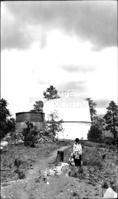 Charles Harold Woolf in front of building