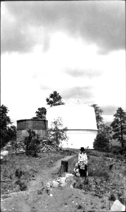 Charles Harold Woolf in front of building