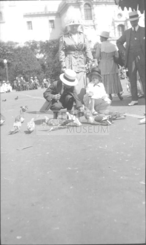 Charles Howard and Dorothy feeding pigeons