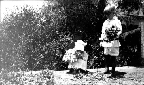 Charles Harold and Dorothy picking flowers