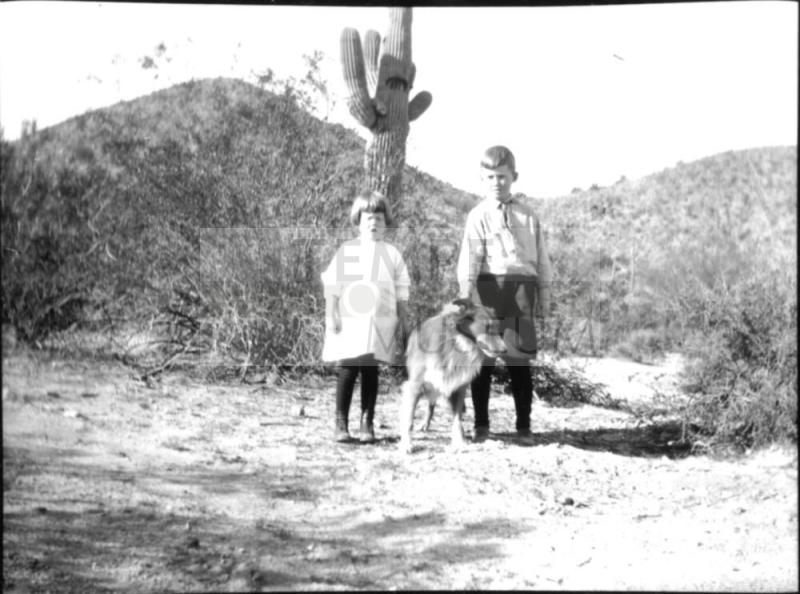 Dorothy and Charles Harold with dog in the desert
