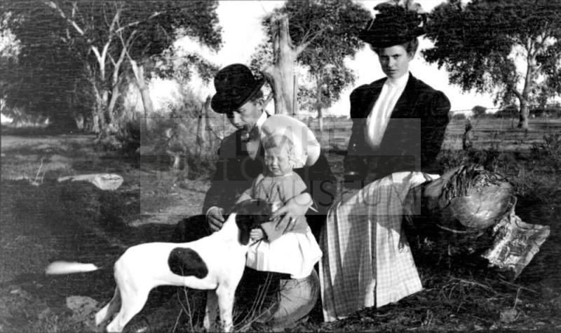 Charles Custis, Ruby, and Charles Harold with dog