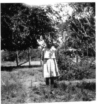 Image of unknown girl standing outdoors