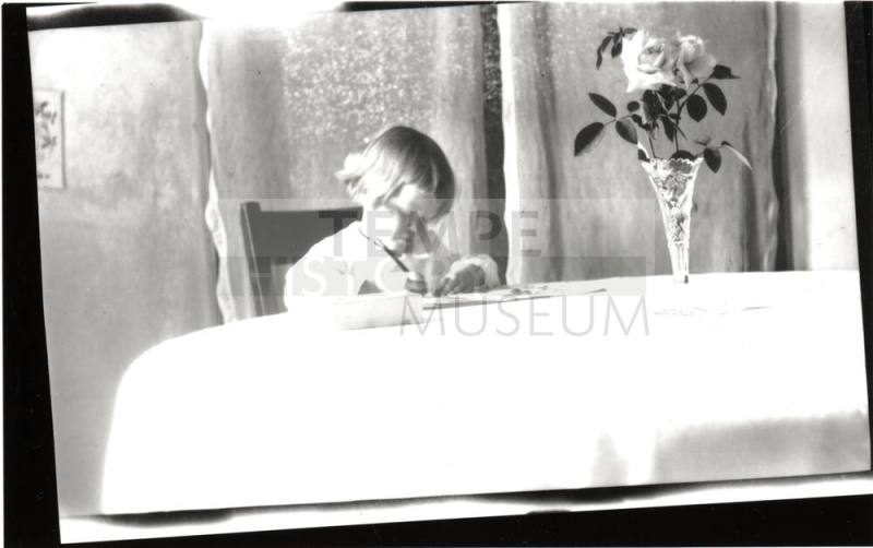 Dorothy writing at table