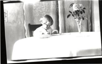 Dorothy writing at table