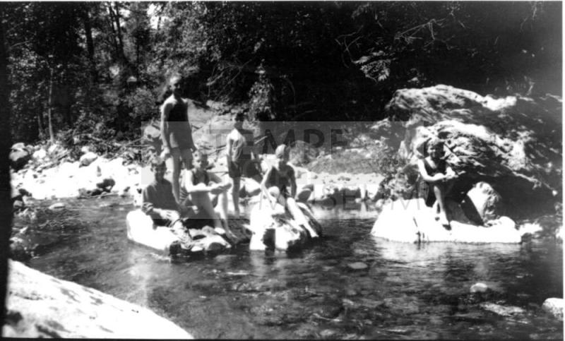 Charles Harold, Dorothy and other children playing and bathing in stream