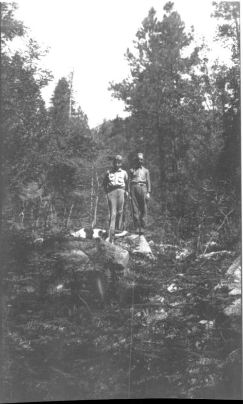Charles Harold and cousin Bill (?) in forest