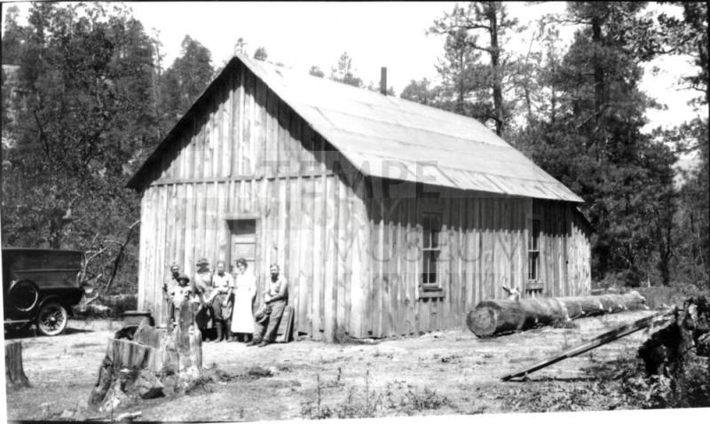 Woolf family group plus others in front of building