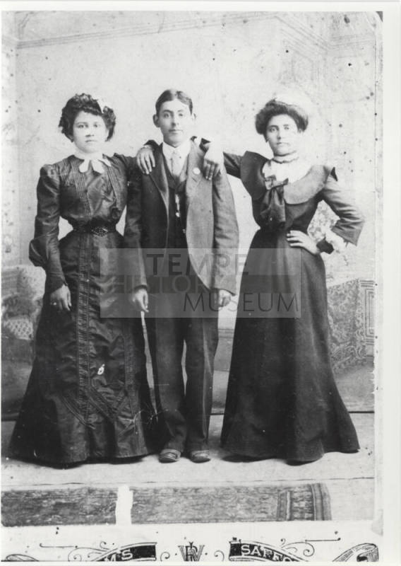 Photo - Pablo Chavarria between two unidentified women