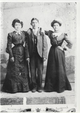 Photo - Pablo Chavarria between two unidentified women