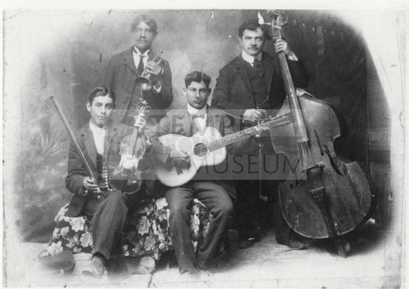 Photo - Mexican Quartet band: Pablo M. Chavarria seated, Mocho Alifonso standing, Francisco M. Chavarria seated, Elavterio Ballesteros standing