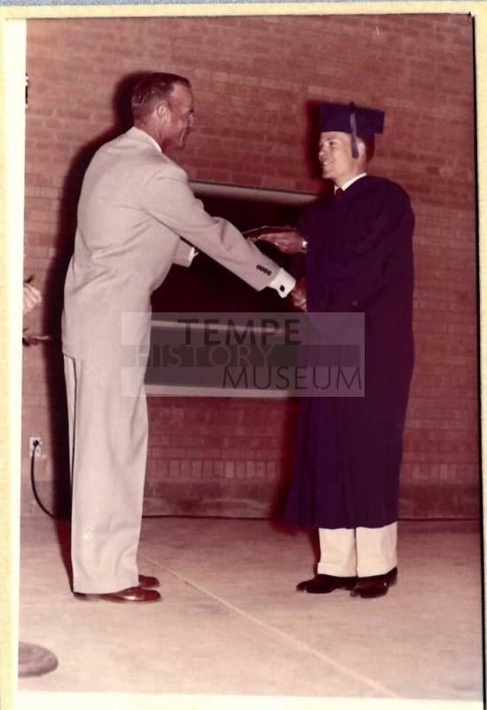 Photograph of Robert Royse Receiving Diploma from Mr. Owens