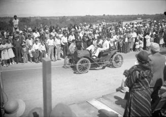 Negative - 2 men in car during parade for dedication of Tempe, Mill Ave Bridge